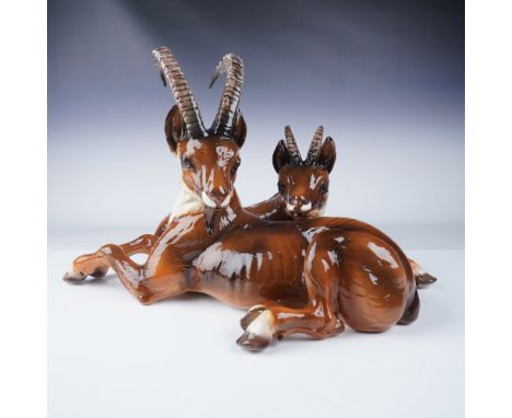 A stunning vintage Ronzan porcelain Majolica sculpture featuring a pair of antelopes reclining in a naturalistic pose. Hand-p