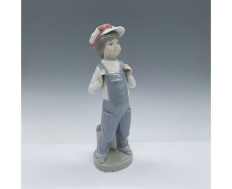 Lladro figurine titled "Boy from Madrid," item number 1004898, meticulously handcrafted in Spain. This piece portrays a young