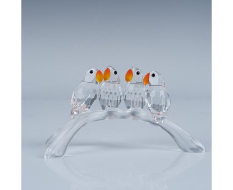 This delightful Swarovski "Baby Lovebirds" figurine, designed by Adi Stocker, showcases the unparalleled craftsmanship of Swa