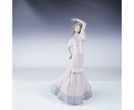 Elegant Nao by Lladro porcelain figurine depicting a graceful flamenco dancer in a flowing pastel-colored dress with ruffled 