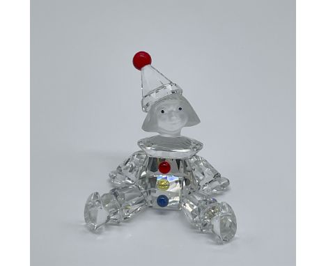 A charming Swarovski Silver Crystal figurine titled "Puppet" (No. 217 207). This delightful piece features a playful puppet d