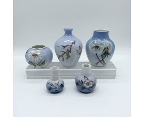 Set of five Royal Copenhagen porcelain miniature vases, each featuring delicate hand-painted floral and botanical motifs on a