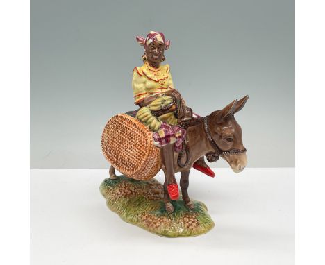 A vintage Beswick figurine titled Susie Jamaica, model number 1347, featuring a Jamaican woman riding a donkey with baskets o