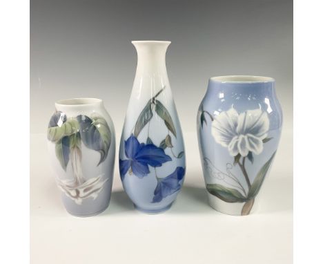 A stunning collection of 3 porcelain vases, each featuring elegant floral designs and showcasing the brand's delicate artistr