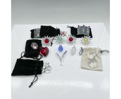 This lot features an exquisite assortment of Swarovski crystal pieces, showcasing the brand's unparalleled craftsmanship and 