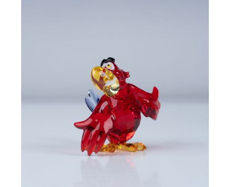 Presenting a vibrant Swarovski crystal figurine of Iago, the mischievous parrot from Disney's Aladdin. This piece is meticulo