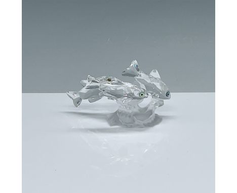 This exquisite Swarovski crystal figurine, "South Sea Fish," showcases three beautifully crafted fish swimming gracefully aro