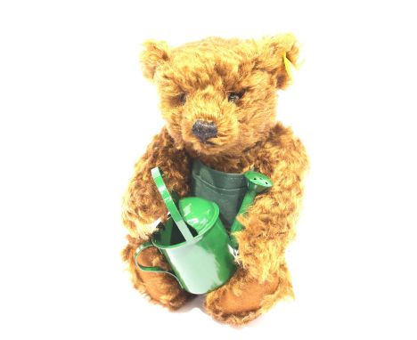 Steiff teddy bear Saturday with watering can certificate, serial no. 0811. P&amp;P Group 1 (£14+VAT for the first lot and £1+