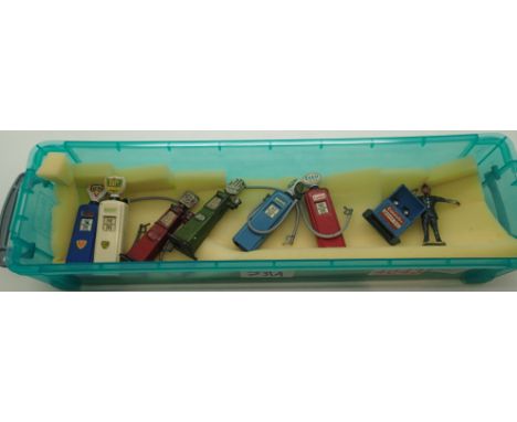 Six vintage cast metal petrol pumps; FNA, BP, Dominion, Esso etc. Esso lube oil cabinet and traffic directing Policeman pumps