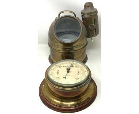 A ship's barometer, by J N Taylor & Co, Adelaide, in a brass case with a mahogany mount, 24 cm diameter, a compass, in a bras