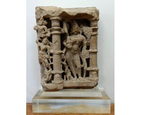 A carved stone temple carving, decorated figure, in a perspex mount, 43 x 30 cmAge unknown, consigned from a storage unit,  s