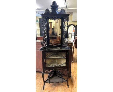 An early 20th century mahogany Chippendale style corner cupboard 