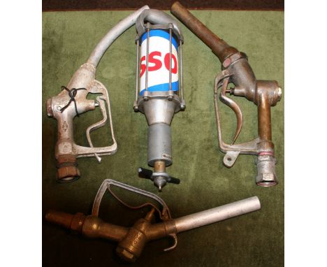 An Esso manual oil pump and three pump handles (4).