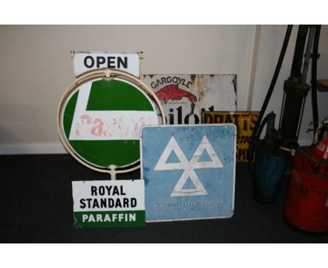 A circular Castrol swing sign with cast iron base, a double sided enamel Royal Standard Paraffin sign and an MOT testing sign