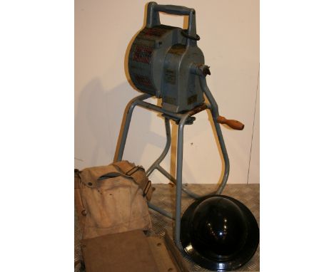 A WWII Secomai hand operated siren, Type 447, with Home Office label, a gas mask in case, a helmet and two document cases. 