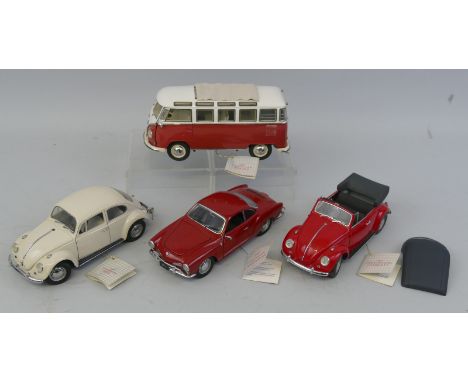 Franklin Mint 1/24 scale die cast models; 1962 VW 25 window microbus, 1967 VW Karmann Ghia, 1967 VW Beetle Cabriolet and 1967