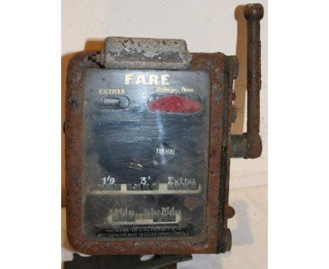 A Metropolitan Taximeter with engine and gearbox drive.