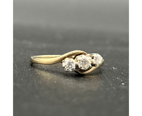 9ct yellow gold 3 stone diamond twist ring,
size J 1/2,
1.6 grams,