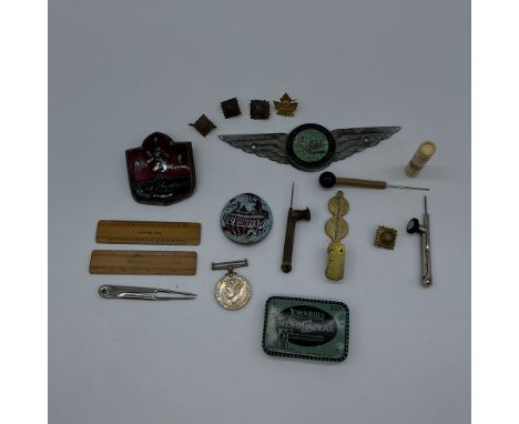 A box of buttons,
gold sovereign coins scales,
war medal,
rulers, and a john bull tin