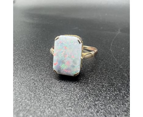 9ct yellow gold opal ring,
2.8 grams,
opal 14mm x 9mm,
size V