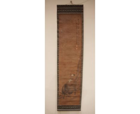 A Chinese bamboo scroll painting (20th century), depicting a boy on a buffalo flying a kite, signed, 180cm x 43cm 
