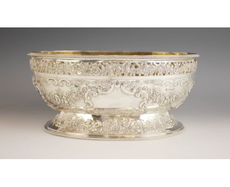 A late Victorian silver centrepiece dish, Martin, Hall & Co, Sheffield 1899, of oval form on raised foot, with pierced floral