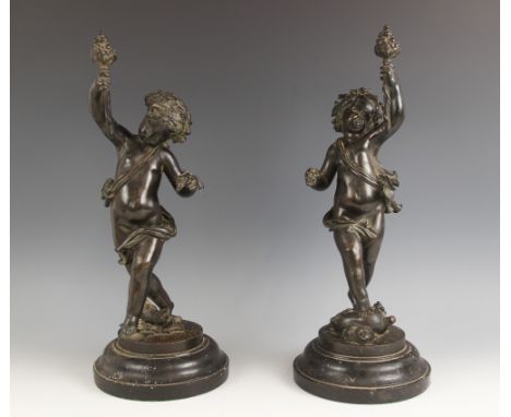 Two patinated bronze putti, 19th century, each modelled as the infant Bacchus, one standing on a wine skin, the other on a wi