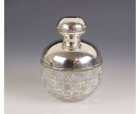 An Edwardian cut glass silver mounted scent bottle, Birmingham 1909 (maker's mark worn), of globular form with hobnail decora