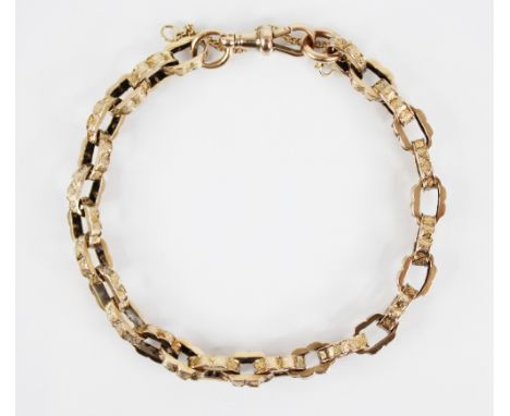 A Victorian 9ct gold belcher link bracelet, each link of oval scalloped form with engine turned detail, spring ring and loop 