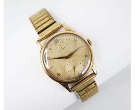 A gentleman's vintage 9ct gold Omega wristwatch, the circular dial with Arabic numerals and arrow head markers, subsidiary se