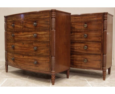 A near pair of late George III mahogany bowfront chests of drawers, circa 1810, each chest with a crossbanded top and reeded 