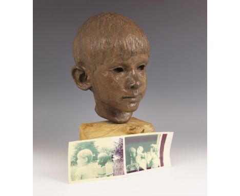 Maureen Coatman (British, 1919–2005), a clay bust of a young boy, signed at base of neck, finished in a bronze glaze and set 