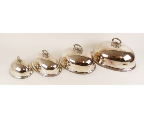 A set of four graduated silver plated dish covers, each of oval form with beaded borders and cast handles, measuring between 