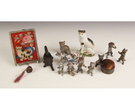 A selection of cold painted cat figures, to include a cold painted bronze novelty cat group, 20th century, modelled as a wait