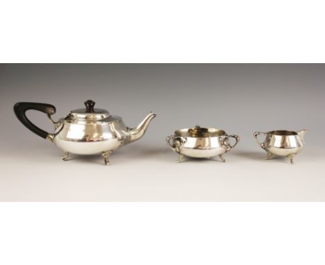 An Arts & Crafts three-piece silver tea service, Charles Edwards, Birmingham 1879, comprising teapot, sucrier and milk jug, e