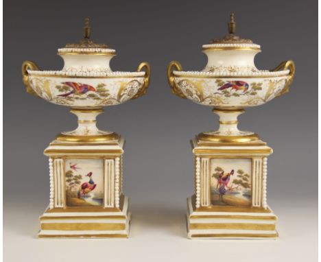 A pair of Paris porcelain pot pouri, 19th century, each modelled as a hemispherical urn on square plinth, the urns with cast 