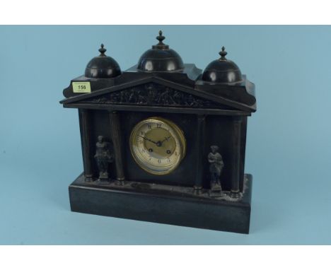 A substantial black marble mantel clock, carved figures flank the brass and painted dial