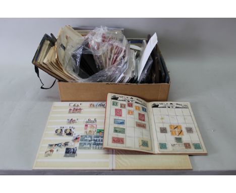 A selection of first day covers and presentation pack stamps, some collectors coins, vintage albums and stock books, part fil