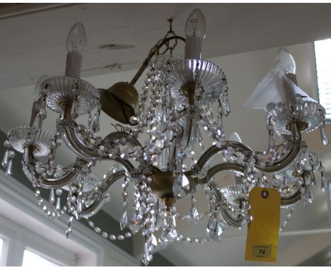 A vintage electrolier pendant eight branch light fitting with cut glass swags and brass fitting, 58cm in dia (some losses to 