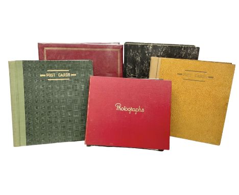 Five albums containing a large quantity of Edwardian and later postcards, predominantly topographical, mostly printed but som