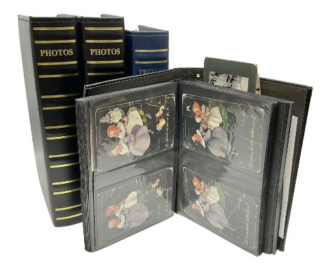 Four modern albums containing approximately eight-hundred and fifty Edwardian and later postcards including real photographic