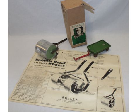 A Knights Head toy garden roller with instructions in original box and a Knights Head four-wheel trolley (2) 