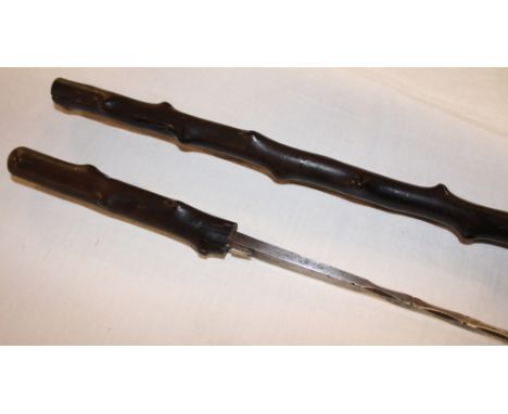A 19th Century gentlemans swordstick with 11½" square tapered blade in blackthorn mounts with button release catch