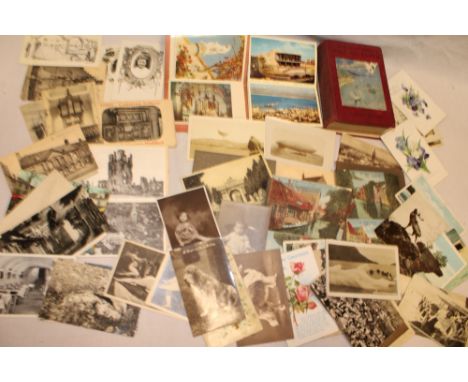 Two photographic postcards of airships, a selection of postcard booklets  of Ypres and other area and a selection of various 