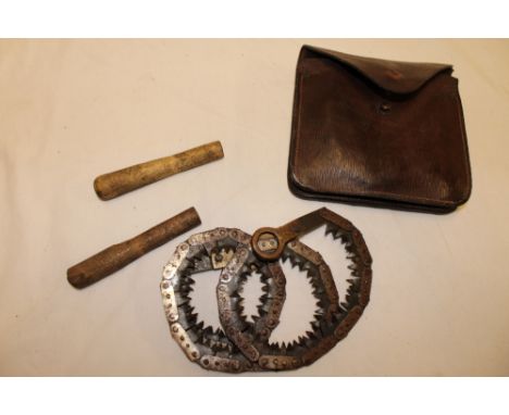 A Second War pioneers folding handsaw with sharpener in fitted leather case dated 1942