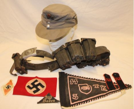 A Second War German leather waist belt with alloy buckle supporting a selection of copy German ammunition pouches, a post-war