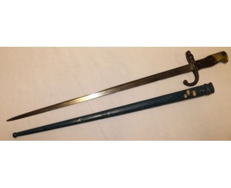 A French Gras bayonet with triangular steel blade dated 1875 in painted scabbard 