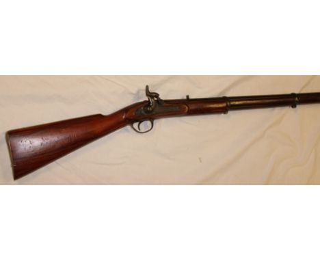 A 19th century Colonial percussion 3-band Enfield musket with 36" steel barrel, plain steel lock and polished wood stock with