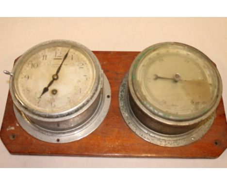 A ship's bulkhead clock by B Cousens & Son Falmouth in chromium plated cylindrical case together with matching bulkhead barom