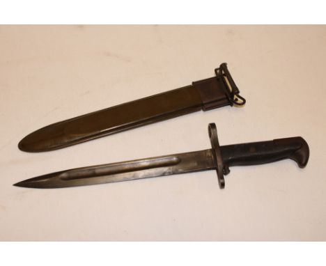A Second War American M1 Garand bayonet in steel mounted composition scabbard